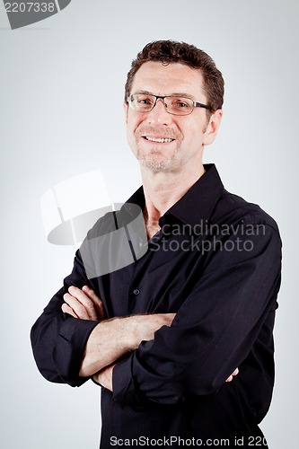 Image of attractive adult man with glasses and black shirt