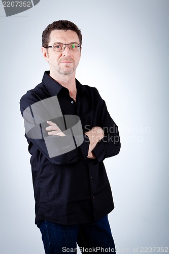 Image of attractive adult man with glasses and black shirt