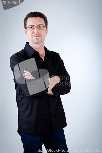 Image of attractive adult man with glasses and black shirt