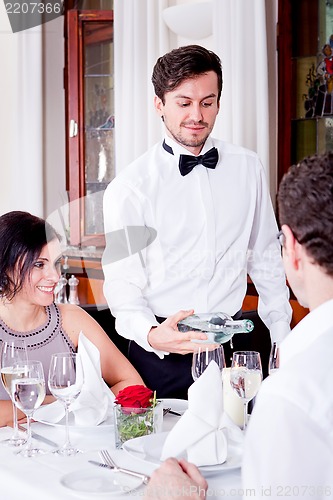 Image of man and woman for dinner in restaurant