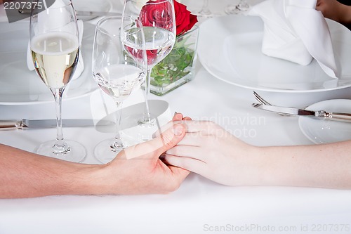 Image of happy smiling couple in restaurant celebrate
