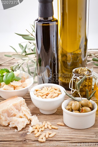 Image of tatsty geen olives parmesan and olive oil 