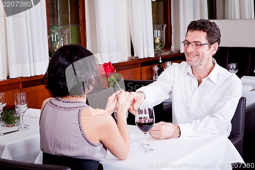 Image of happy couple in restaurant romantic date 
