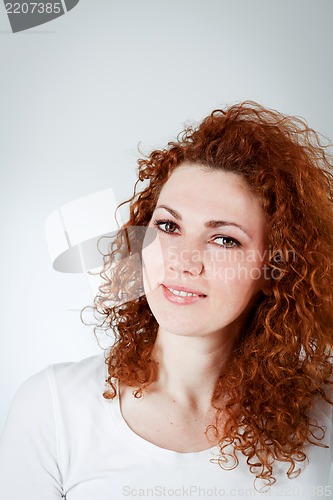 Image of attractive young redhead woman smiling portrait