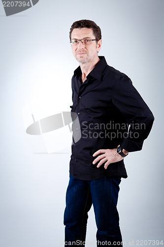 Image of attractive adult man with glasses and black shirt