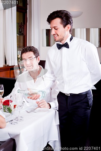 Image of man and woman for dinner in restaurant