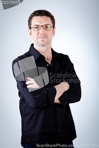 Image of attractive adult man with glasses and black shirt