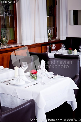 Image of tables in restaurant decoration tableware empty dishware