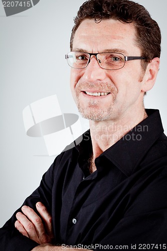 Image of attractive adult man with glasses and black shirt