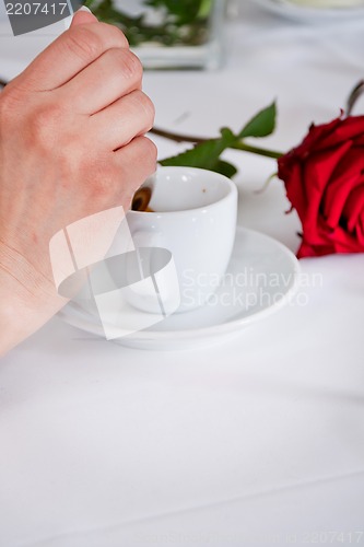 Image of waiter serve fresh espresso for happy couple 
