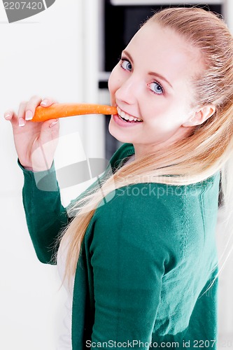 Image of young woman cooking vegetarian food