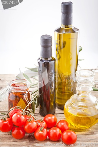 Image of tatsty geen olives tomatoes and olive oil 