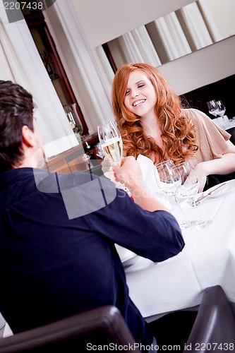 Image of happy smiling couple in restaurant celebrate