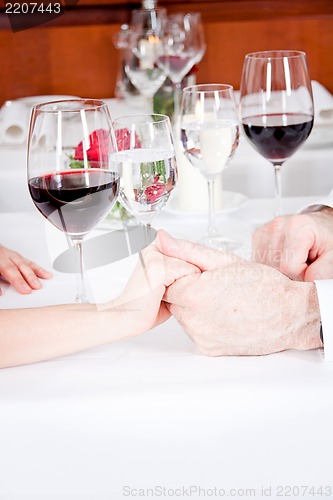 Image of happy smiling couple in restaurant celebrate