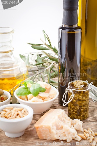 Image of tatsty geen olives parmesan and olive oil 