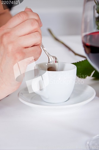 Image of waiter serve fresh espresso for happy couple 