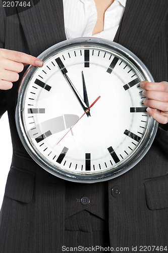 Image of Woman holding a clock