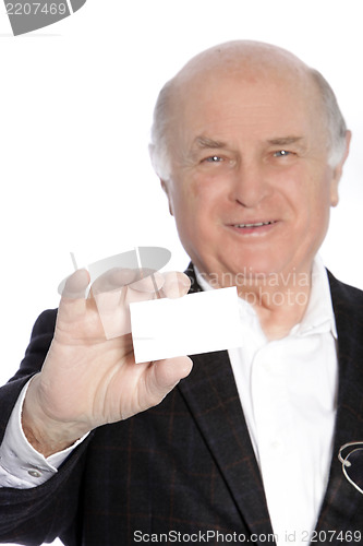 Image of Smiling senior businessman presenting his card