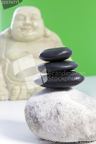 Image of Three black stones stacked on top of each other