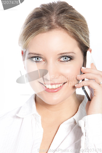 Image of Happy woman using a mobile phone