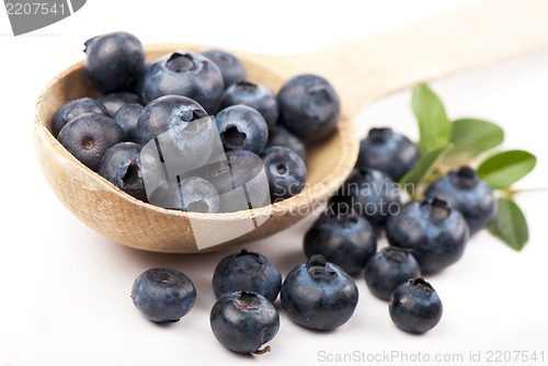 Image of  blueberry in a wooden spoon