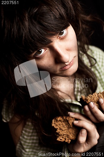 Image of  beggar woman with bread 