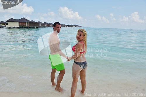Image of happy young  couple at summer vacation have fun and relax