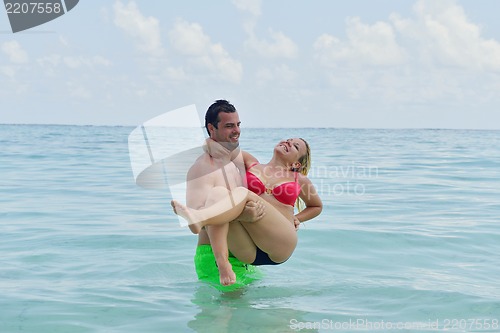 Image of happy young  couple at summer vacation have fun and relax