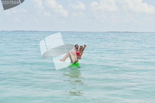Image of happy young  couple at summer vacation have fun and relax