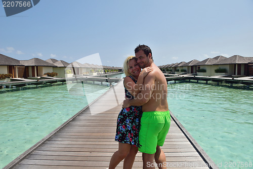 Image of happy young  couple at summer vacation have fun and relax