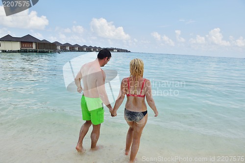 Image of happy young  couple at summer vacation have fun and relax
