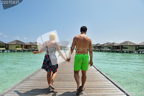 Image of happy young  couple at summer vacation have fun and relax