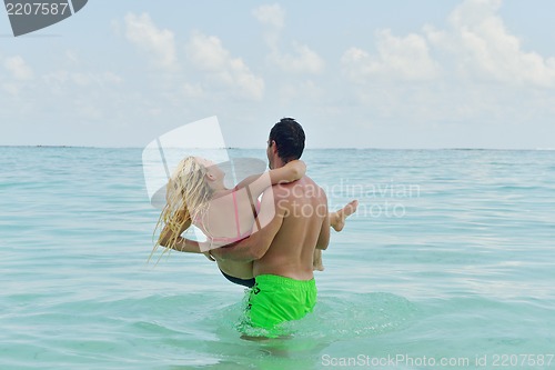Image of happy young  couple at summer vacation have fun and relax