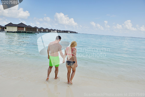 Image of happy young  couple at summer vacation have fun and relax