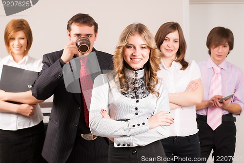 Image of Attractive business lady and her team