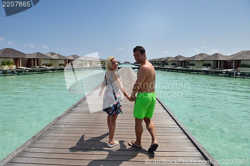Image of happy young  couple at summer vacation have fun and relax