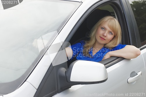 Image of Young woman in car