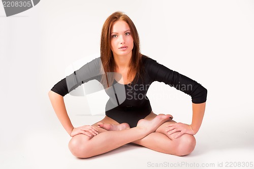 Image of Pretty girl in lotus position exercise