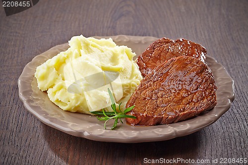 Image of mashed potatoes and beef steak on plate