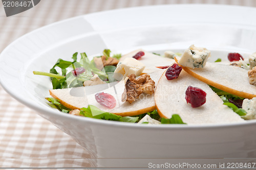 Image of Fresh pears arugula gorgonzola cheese salad