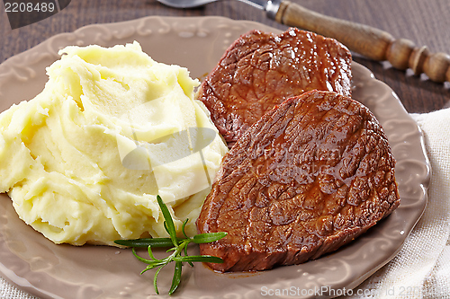 Image of Mashed potatoes and beef steak