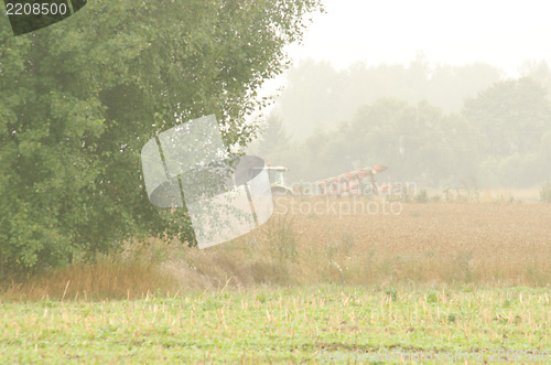 Image of agriculture tractor plow field tree morrning fog 