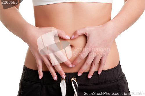 Image of Woman Making a Heart Symbol over her Tummy