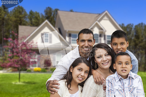 Image of Hispanic Family in Front of Beautiful House