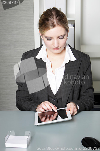 Image of Businesswoman working on a tablet