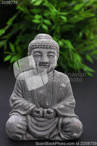 Image of Stone meditating Buddha statue