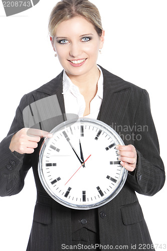 Image of Smiling businesswoman holding a clock