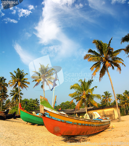 Image of old fishing boats on beach in india