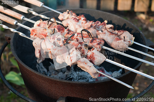 Image of Shish kebab preparation on a brazier