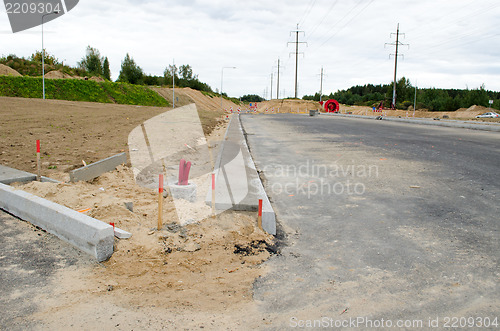 Image of road construction car roundabout electricity wire 